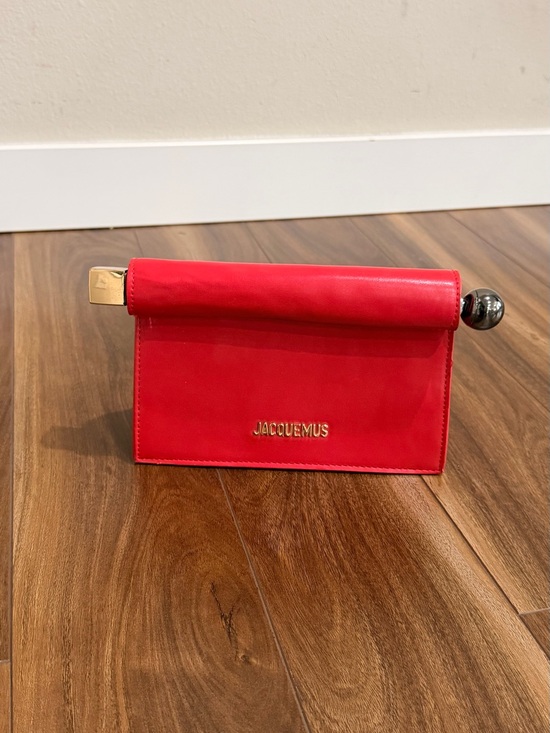 Jacquemus Handbags - Jacquemus red leather roll-top clutch with gold accents